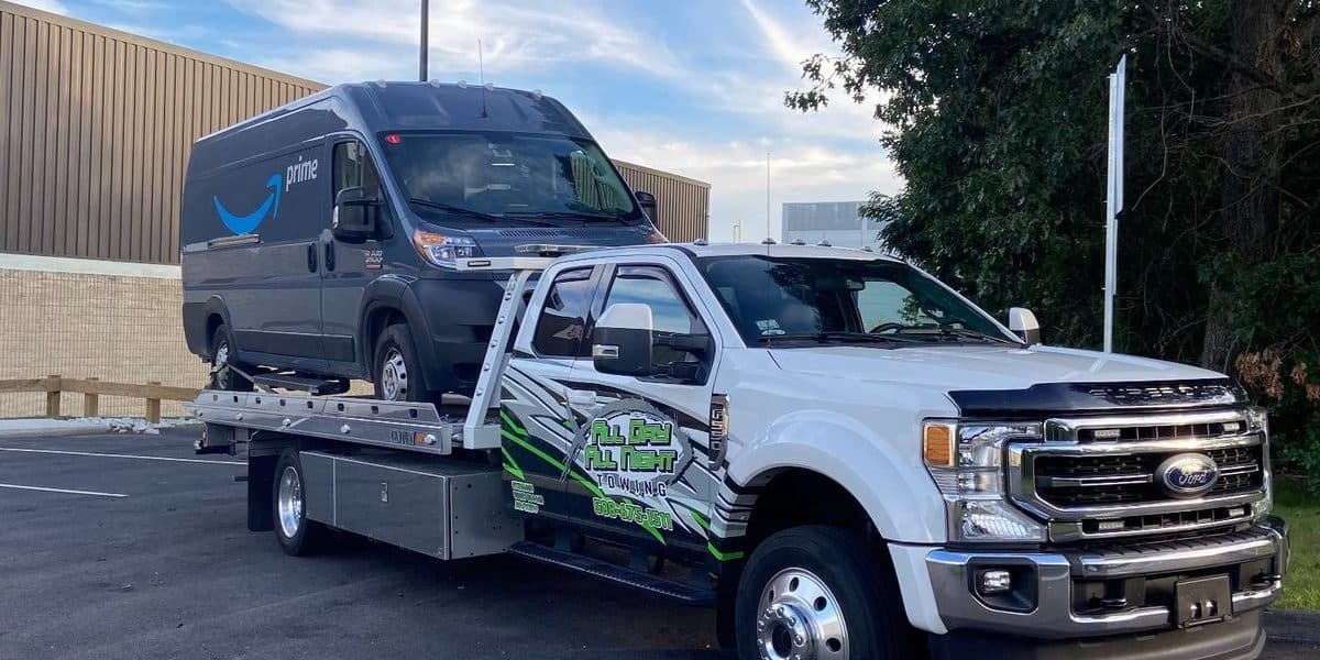 Delivery van loaded on the flatbed